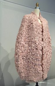 Camellias make up a cape by Chanel at the MET