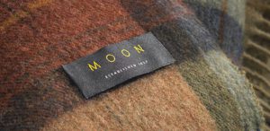 A fine wool throw by Abraham Moon & Sons.